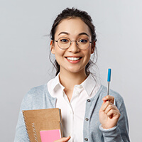 Girl holding pen and notebook for California TVS Operator Licensing 8-hour course online